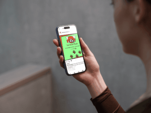 iphone16mockupinawoman'shandwithconcretebackdrop(mockuuupsstudio)